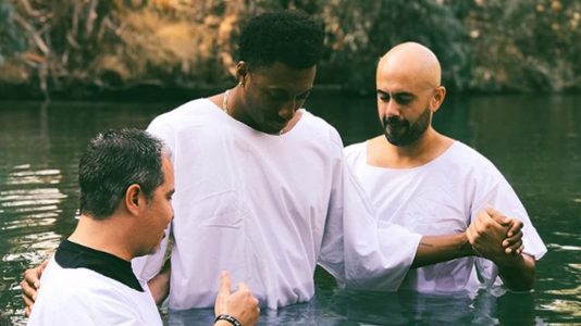 Watch Lecrae Get Baptized Again in the Jordan River